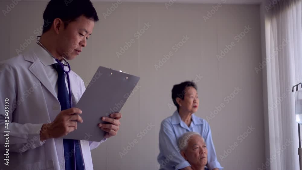 Asian young doctor worry on senior patient chronic symptom disease bad news Asian young doctor worry on senior patient chronic symptom disease bad news