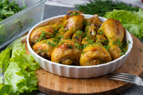 Fried tasty chicken drumstick served in white bawl with spices