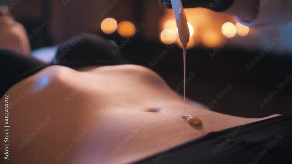 Sugaring. removal of hair from the abdomen with sugar paste in a beautiful girl. Belly epilation. Wax