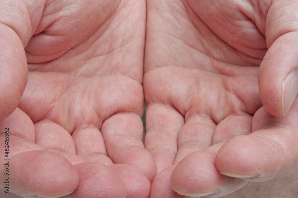 Caucasian male cupped hands. Empty palms together, macro close up top view Caucasian male cupped hands. Empty palms together, macro close up top view