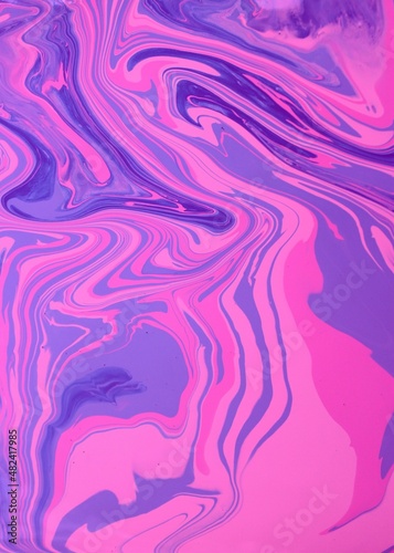 Abstract background of lilac-pink marble. Acrylic texture with marble pattern. Mixing colors creates an interesting structure. It is well suited for laptop background and wallpaper, fabric