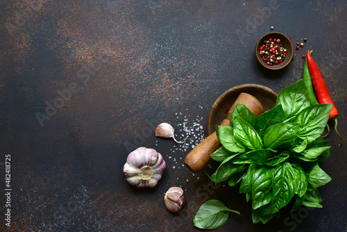 Traditional mediterranean spices : sea salt, basil, garlic, pepper. Top view with copy space.