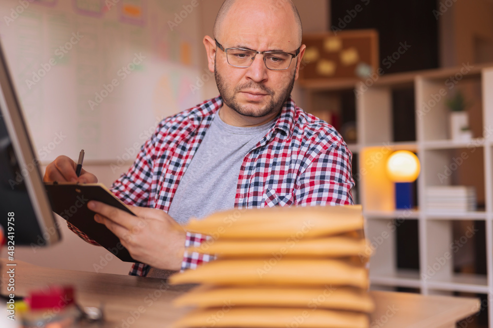 Entrepreneur getting online store orders ready for shipping Entrepreneur getting online store orders ready for shipping
