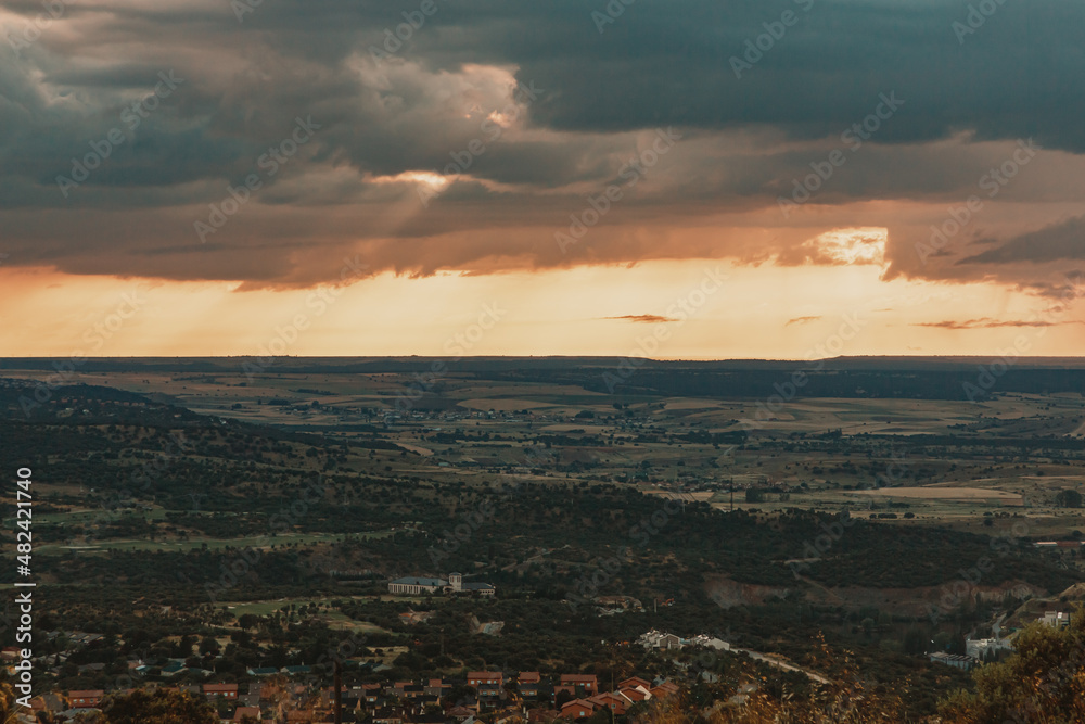 View of a small village in the mountains of Segovia at sunset.