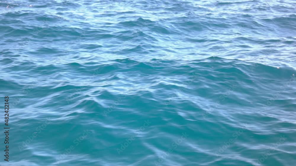 Close up view from moving boat of turquoise sea waves. Close up view from moving boat of turquoise sea waves.