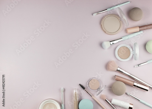 Decorative cosmetics: highlighter, concealer, powder ,brush, face sculpture . Make up,flat layot photo