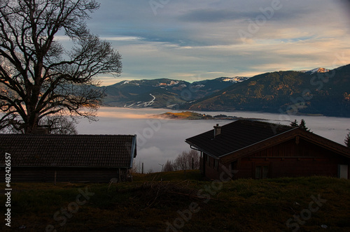 pinzgauer saalachtal bei saalfelden mit nebel aufgefüllt mit almhütte im vordergrund vom biberg gesehen salzburg österreich, saalach valley at saalfelden drowned in a sea of fog austria alps photo