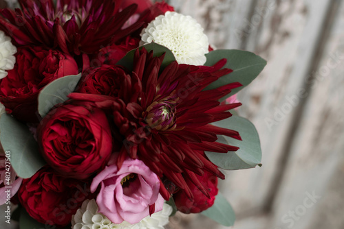 Wedding bouquet . The bride's bouquet. Bouquet of red flowers. Bridal douquet composed of dahlia and roses. photo