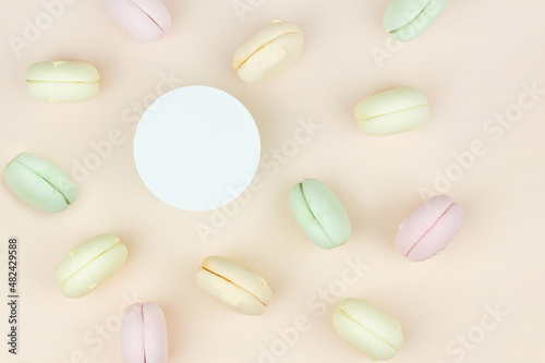 Sweet and colourful marshmallow french macaroons with round copy space. Concept of sweet dessert