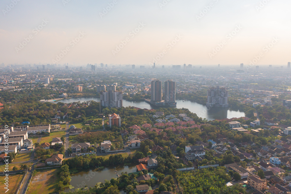 Obraz premium Aerial view of residential neighborhood. Urban housing development from above. Top view. Real estate in urban city town. Property real estate.