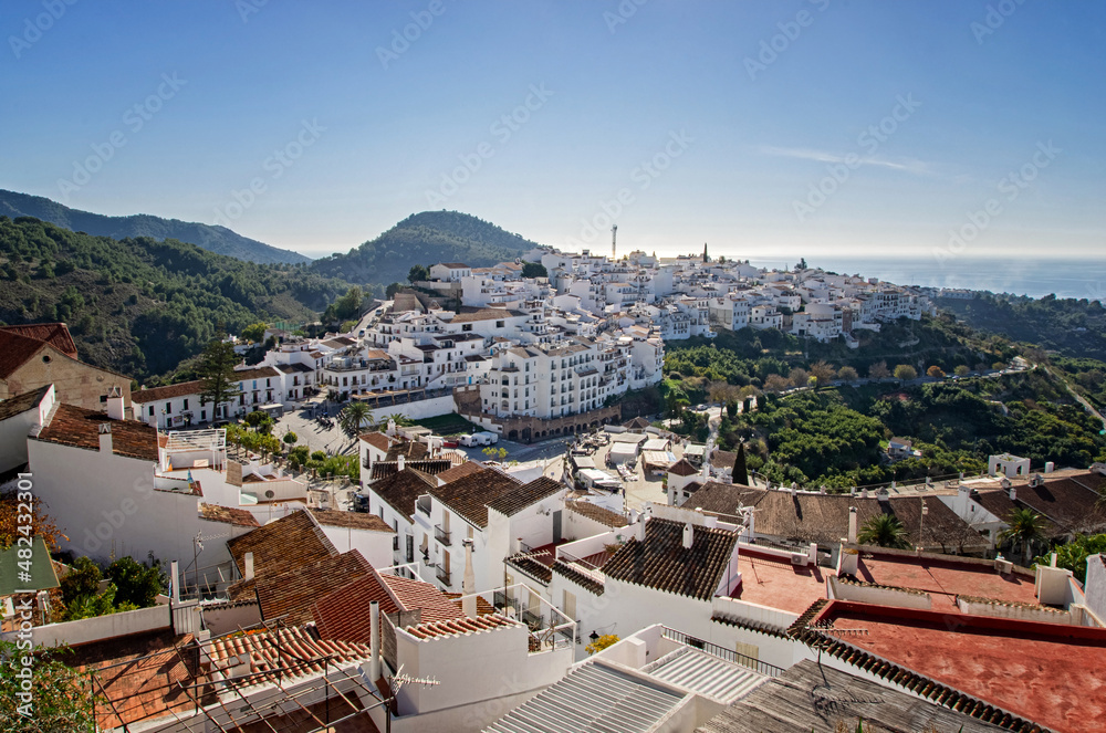 View of famous white village - pueblo blanco - called Frigiliana. White houses in small village in the mountains.