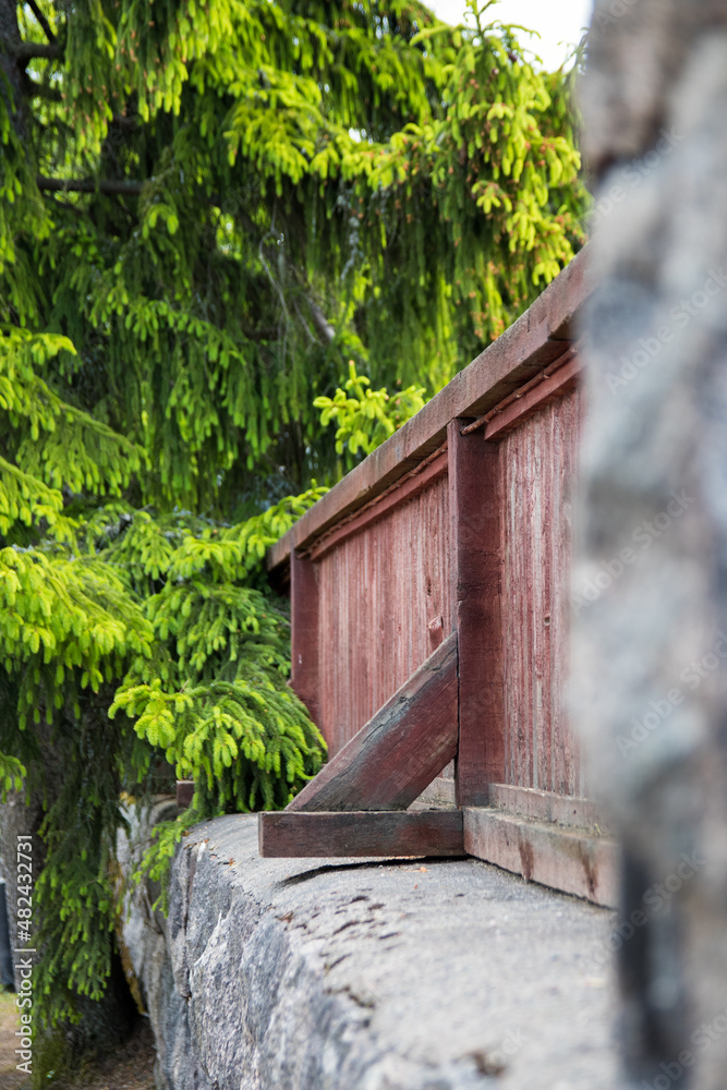 Stone wall with wooden structures Stone wall with wooden structures