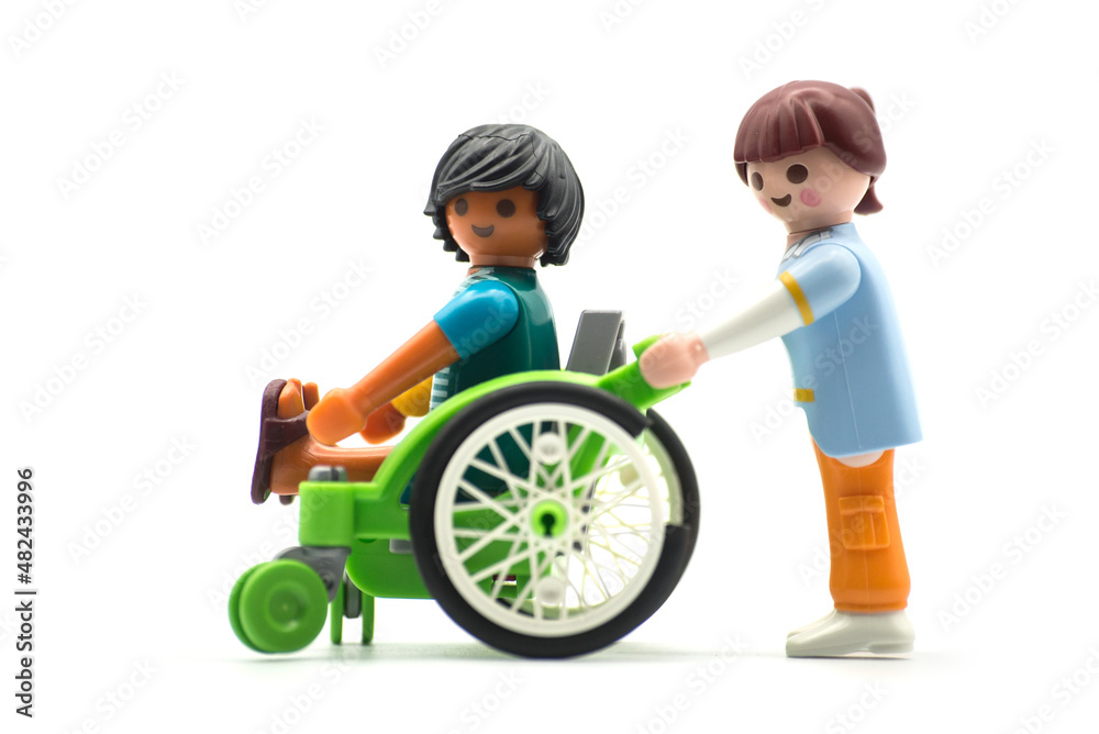 Mulhouse - France - 24 January 2022 - Closeup of playmobil figurines on  white backgorund - nurse and disabled man in a wheelchair Stock Photo |  Adobe Stock