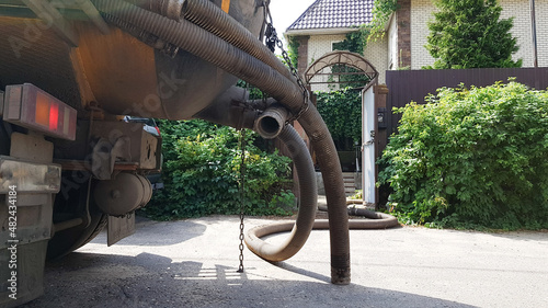 Image of units of a pumping machine for pumping out a septic tank. Sewerage in a private house.