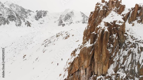 Wallpaper Mural Aerial shot of man in winter mountains Torontodigital.ca