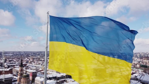 Ukrainian flag in the wind. Blue Yellow flag in the city of Kharkov	 photo