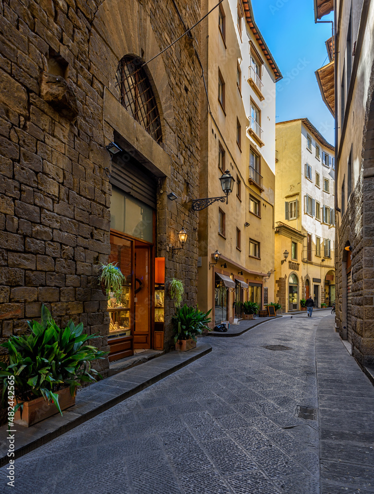 Narrow cozy street in Florence, Tuscany, Italy. Architecture and landmark of Florence. Cozy Florence cityscape