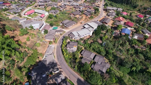 Aerial view of traditional local tribe village neightborhood in the valley surrounded by tropical rainforest at countryside photo