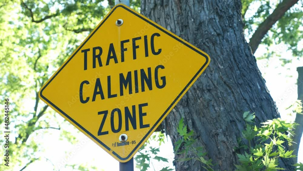 Tilt down to traffic calming zone sign. Trucks and lorries forbidden