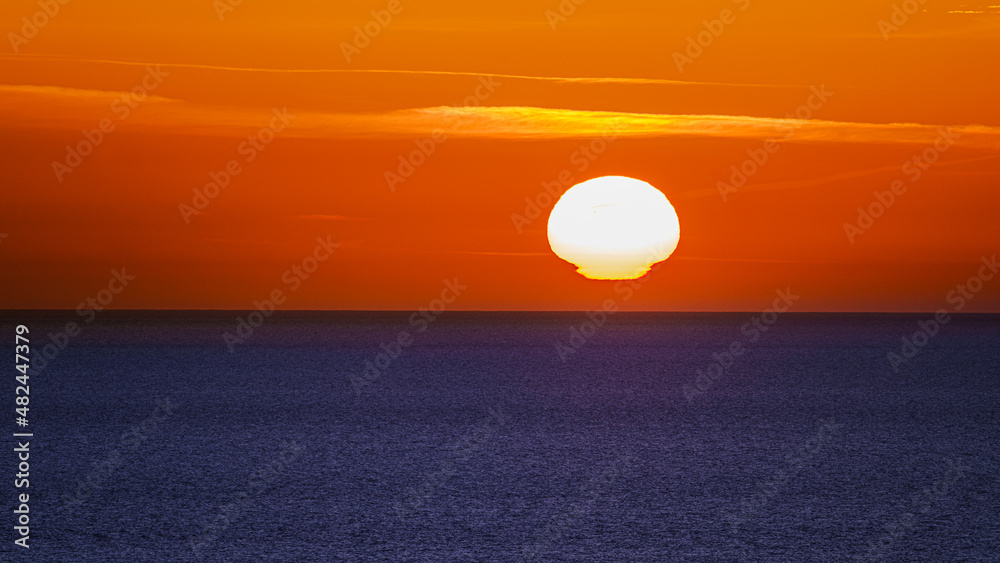 Sunset over water.  Sunrise over sea