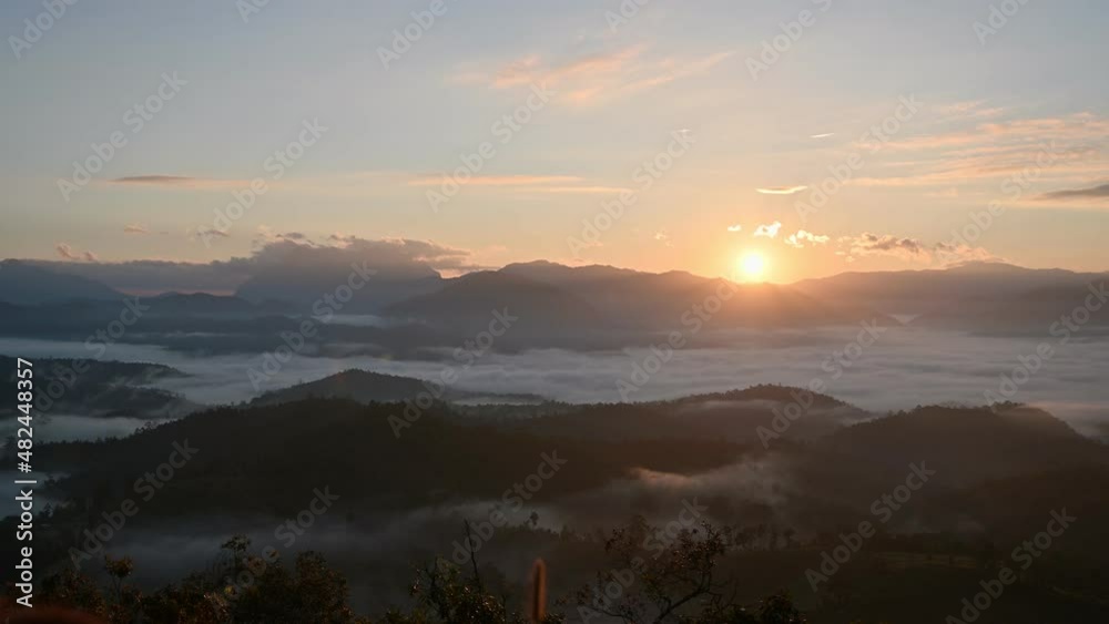 Sunrise shining over mountain range with foggy on hill in national park at Den TV viewpoint Sunrise shining over mountain range with foggy on hill in national park at Den TV viewpoint