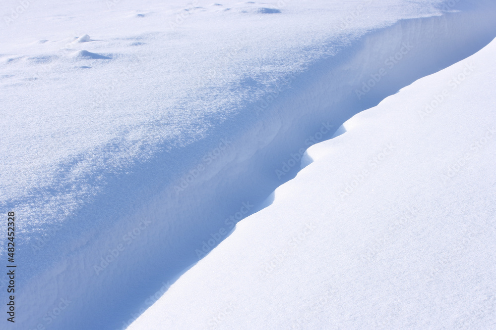 Blue and white snow on a sunny winter day