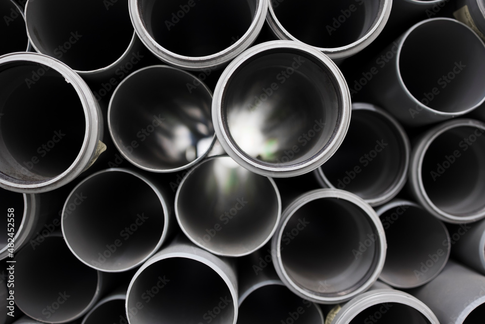 PVC water pipe in storage . Background of plastic pipes PVC water pipe in storage . Background of plastic pipes