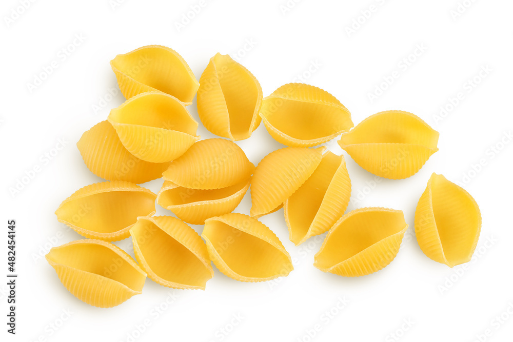 Uncooked dried conchiglie. Raw organic shell pasta isolated on white bachground with clipping path and full depth of field. Top view. Flat lay Uncooked dried conchiglie. Raw organic shell pasta isolated on white bachground with clipping path and full depth of field. Top view. Flat lay