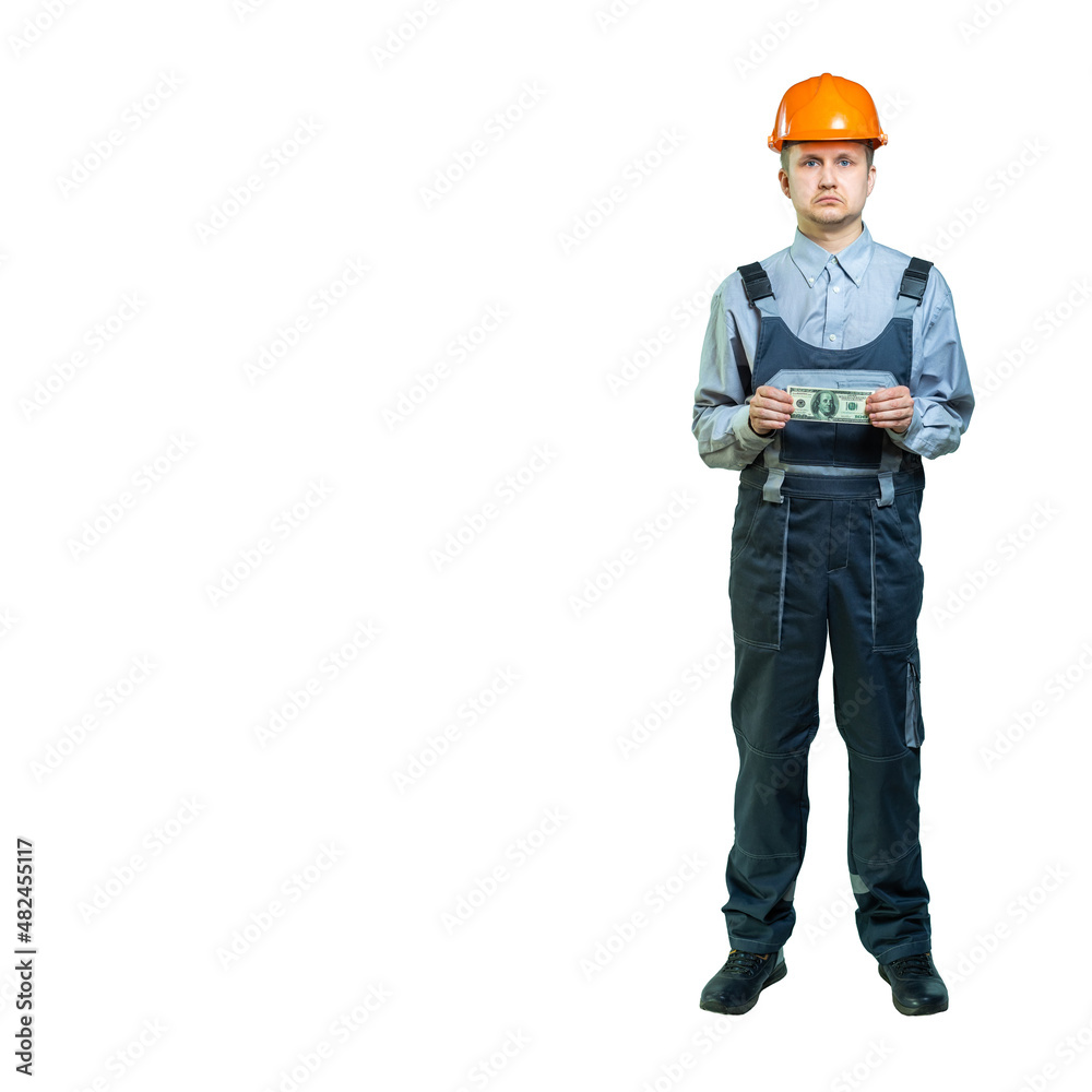 Worker, engineer, specialist holds a dollar in his hands. the man is upset by the amount of money earned, the corners of his lips sank down. isolated Worker, engineer, specialist holds a dollar in his hands. the man is upset by the amount of money earned, the corners of his lips sank down. isolated