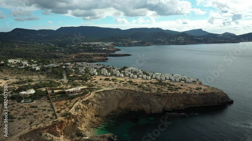 Drone flying towards Cala Codolar beach, in Sant Josep de sa Talaia, Ibiza. photo
