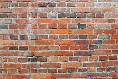 Close-up of an old red brick wall.