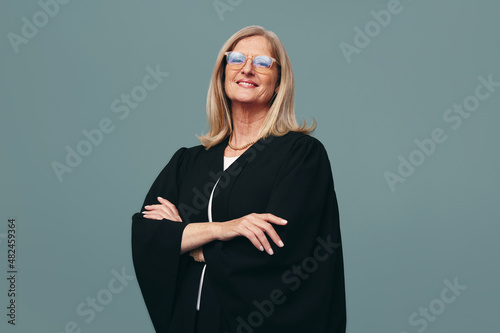 Cheerful female judge smiling at the camera in a studio photo