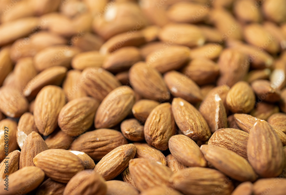 Macro shooting of dry Almond Nuts.Vegetarian food rich in minerals and vitamins. Selective focus Macro shooting of dry Almond Nuts.Vegetarian food rich in minerals and vitamins. Selective focus