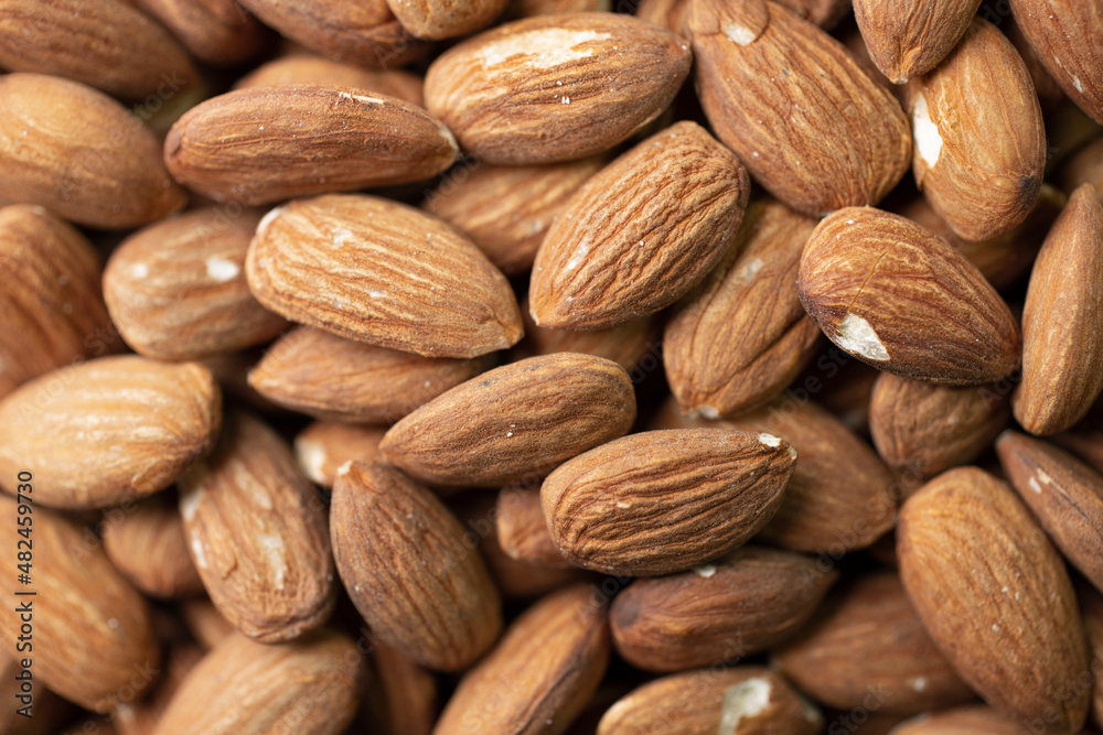 Macro shooting of dry Almond Nuts.Vegetarian food rich in minerals and vitamins. Selective focus Macro shooting of dry Almond Nuts.Vegetarian food rich in minerals and vitamins. Selective focus