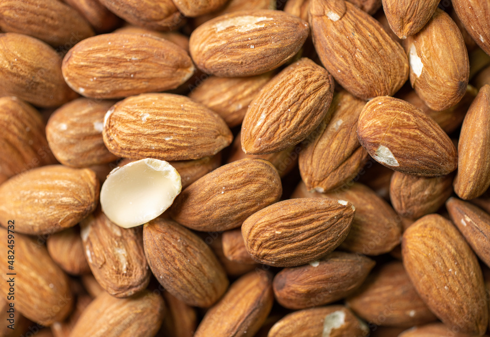 Macro shooting of dry Almond Nuts.Vegetarian food rich in minerals and vitamins. Selective focus Macro shooting of dry Almond Nuts.Vegetarian food rich in minerals and vitamins. Selective focus