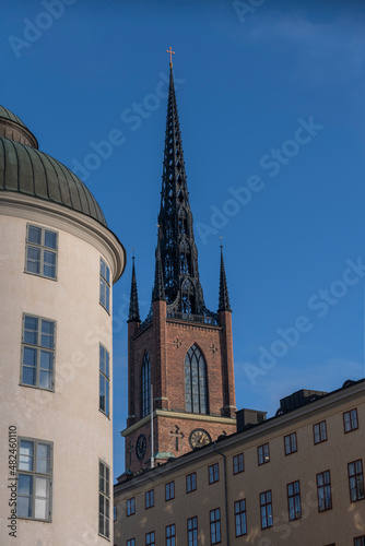 Facades of court houses and the tower of the church Riddarholmskyrkan a sunny winter day in Stockholm