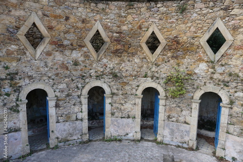 old stone bath buildings ruins in the pyrénées, france © poupine
