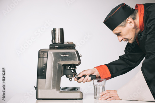 Chief preparing several espresso coffee style drinks photo