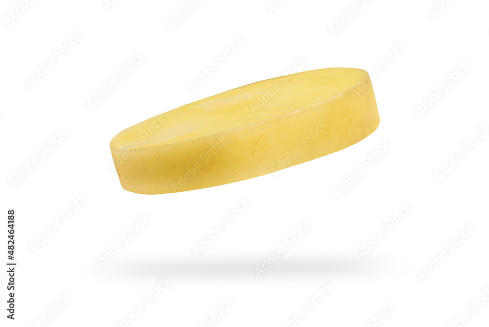 A slice of fresh unpeeled potatoes falls on a white background. Chopped raw potatoes. Food levitation concept. High resolution image
