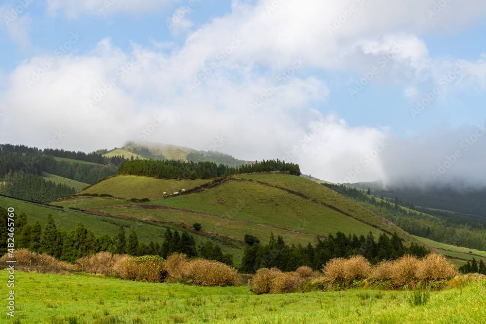 landscape with clouds in mountains and hills of Sao Miguel the Azores, Portugal