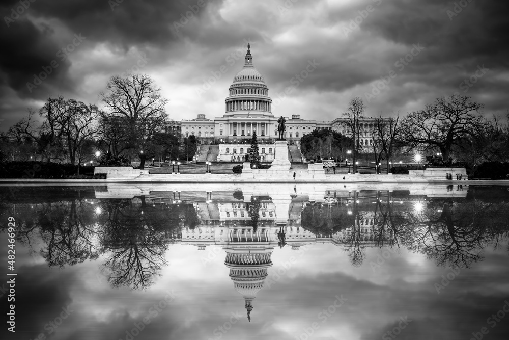 Fototapeta premium View of the United State Capitol Building in black and white with reflections and clouds