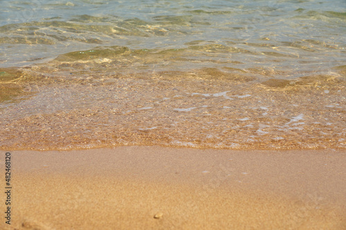 Waves on the tropical sandy beach of the red sea.