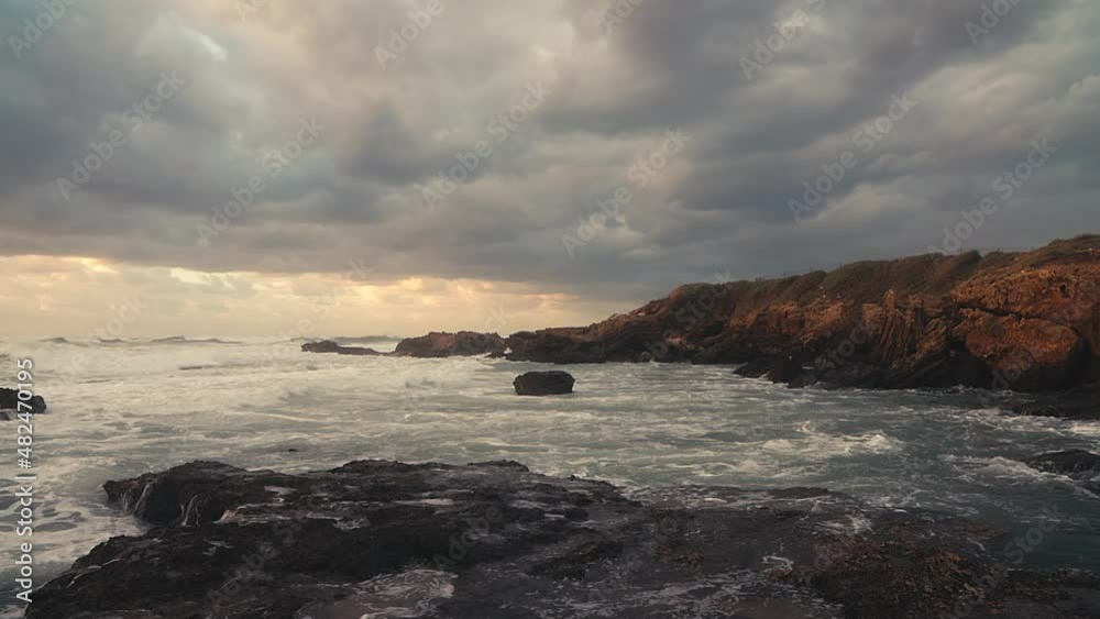 View of the storm on mediterranean sea from a rocky cliff View of the storm on mediterranean sea from a rocky cliff