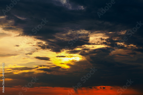 Burning sky in the evening . Dark and orange dramatic sky