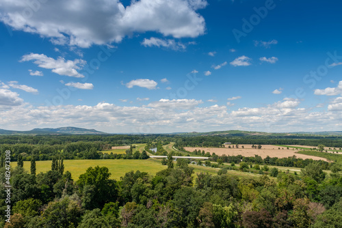 Lednice-Valtice complex, view from Minaret-observation tower for park with trees, river Thaya on background limestone Palava hills © patrikslezak