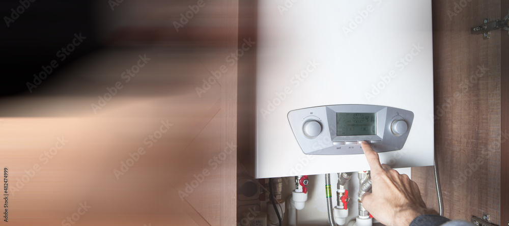 Naklejka premium the man controls the heating system