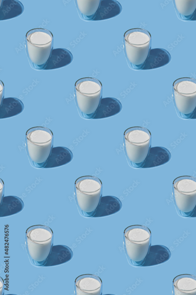 World Milk Day. Pattern on a blue background. A glass of milk. Sample. Vertical World Milk Day. Pattern on a blue background. A glass of milk. Sample. Vertical