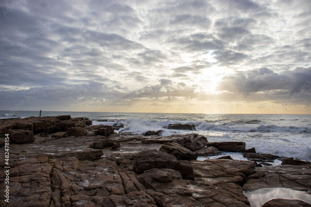 View of the ocean with rocks and morning clouds in South Africa