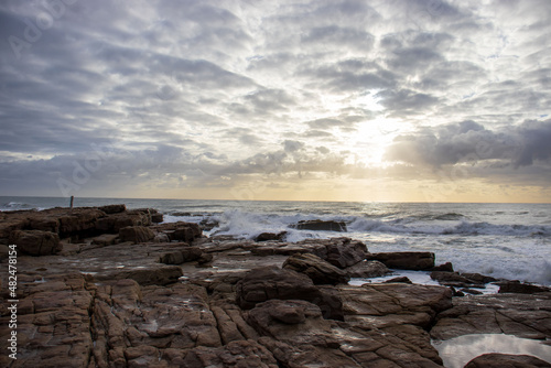 View of the ocean with rocks and morning clouds in South Africa