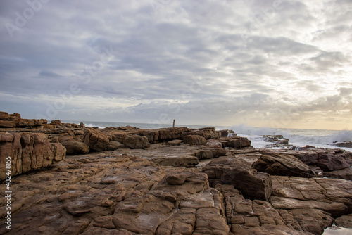 View of the ocean with rocks and morning clouds in South Africa